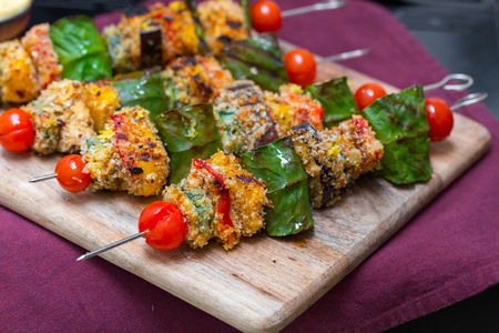 Skewers of scamorza cheese on the bbq