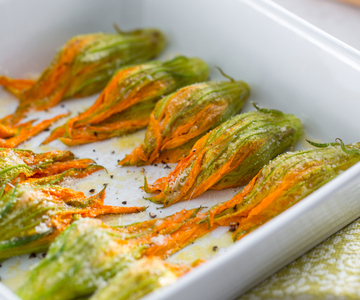 Baked zucchini flowers with anchovies and Grana Padano