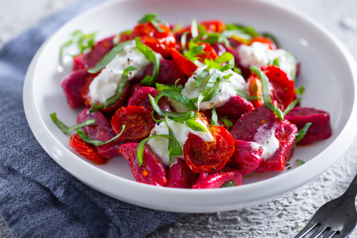 Beetroot gnocchetti with cherry tomatoes and stracciatella