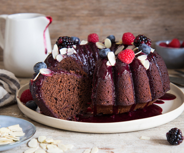 Cake with cocoa and almonds with red fruit sauce