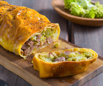 Savory strudel with Asiago PDO, broccoli, and sausage
