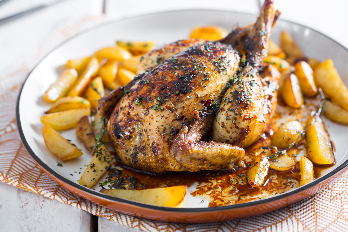 Spring chicken with aromatic herbs and lard with beer potatoes