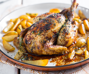 Spring chicken with aromatic herbs and lard with beer potatoes