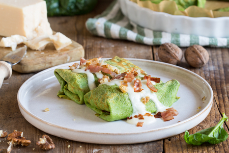 Crepes with pumpkin, speck, and walnuts