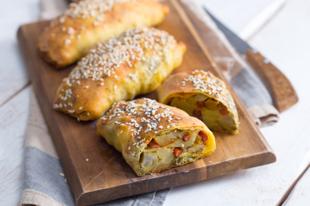Savory mini strudels with artichokes, potatoes, and speck