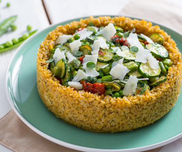 Rice pie with peas, asparagus, and zucchini