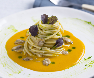 Spaghetti with clams, pumpkin sauce, and mandarin mustard