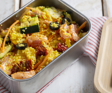 Lunch box with couscous and salmon