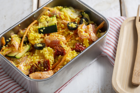 Lunch box with couscous and salmon