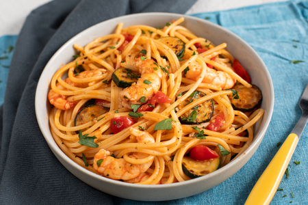 Pasta with zucchini, shrimp, and cherry tomatoes