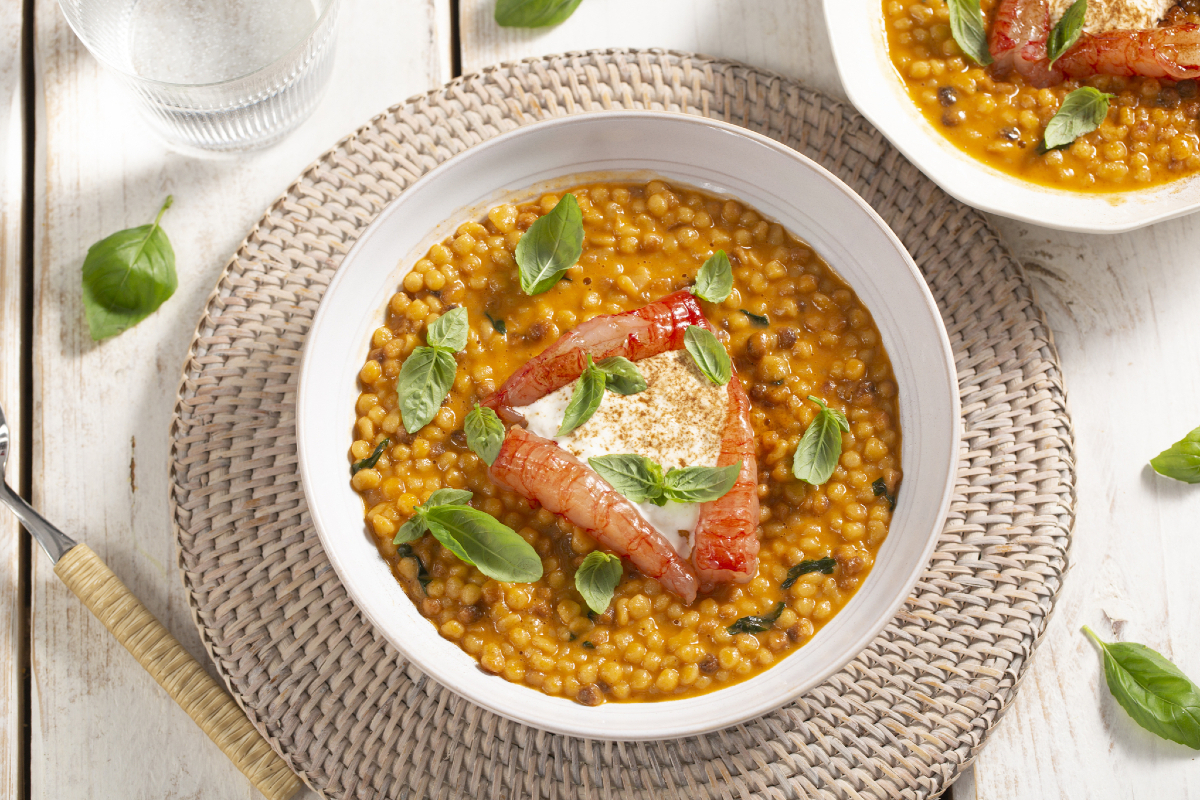 Fregola with shrimp, stracciatella, and licorice