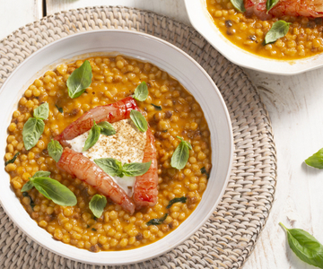 Fregola with shrimp, stracciatella, and licorice