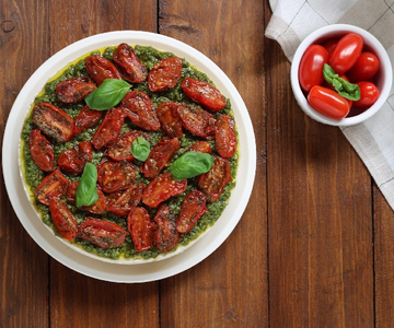 Savory cheesecake with pesto and cherry tomatoes
