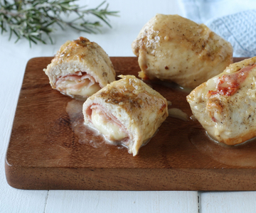 Chicken rolls in a pan