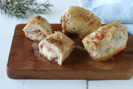 Chicken rolls in a pan