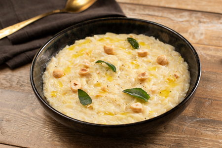 Orzo with leeks, robiola cheese, and hazelnuts