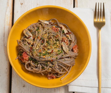 Buckwheat spaghetti with anchovies and cherry tomatoes