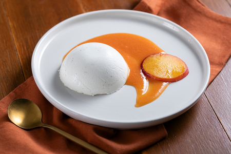 Panna cotta with peach coulis