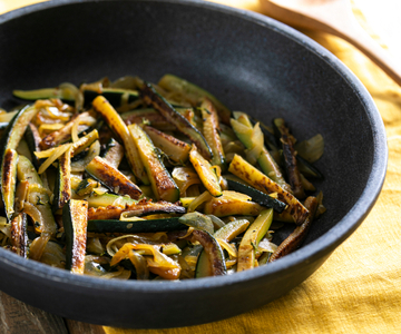 Tasty pan-fried zucchini with onion