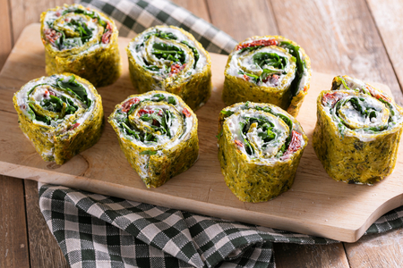 Zucchini rolls with ricotta and sun-dried tomatoes