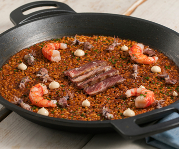 Paella with shrimp, squid, and Iberian presa