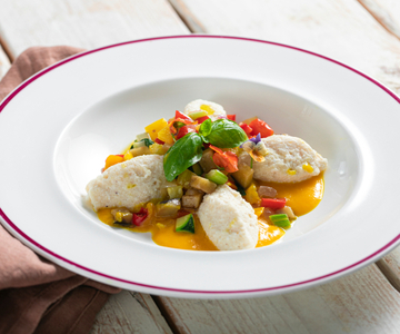 Ricotta gnudi with vegetable ragù
