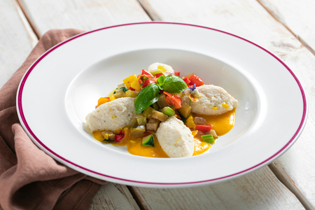 Ricotta gnudi with vegetable ragù