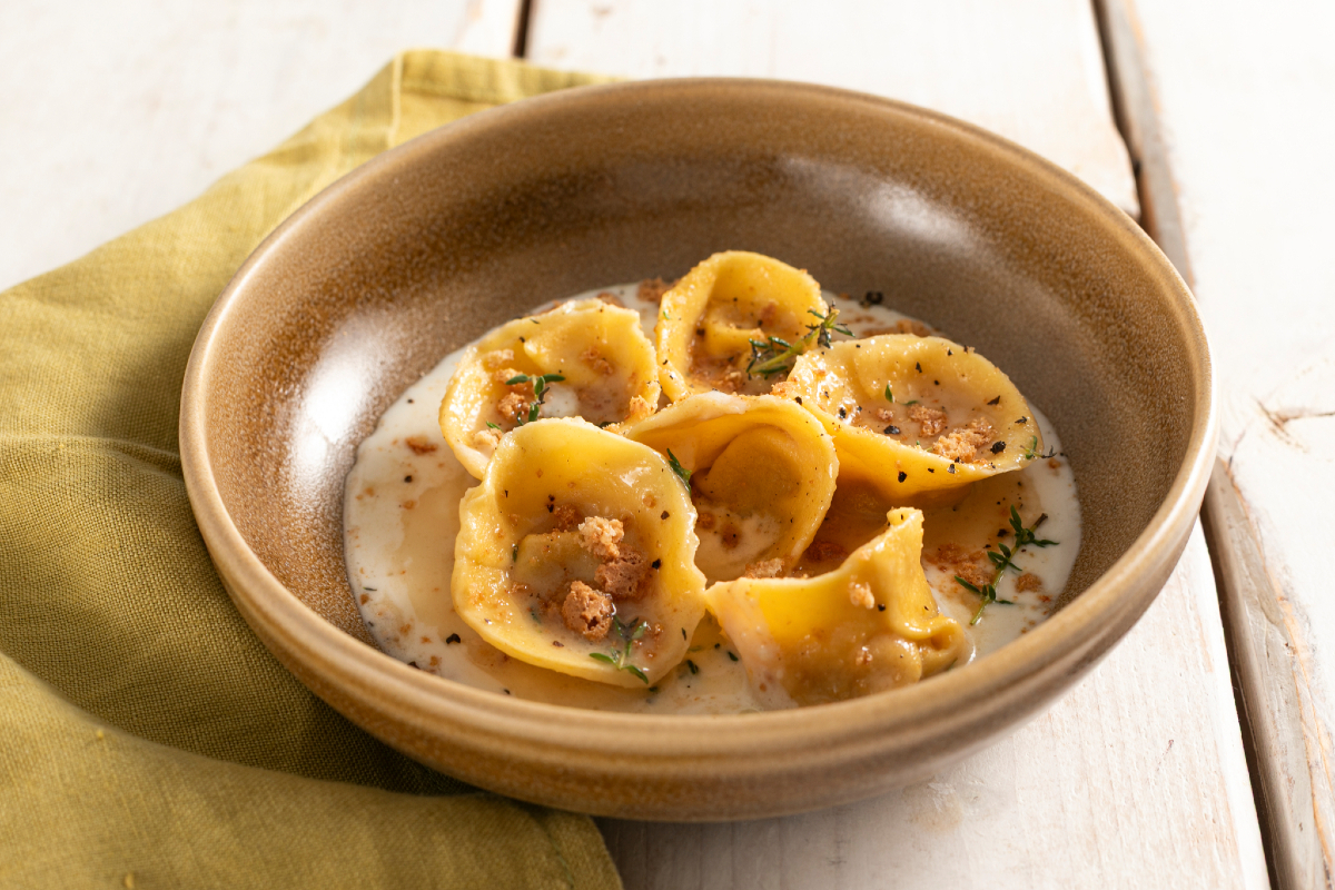 Pumpkin and amaretti filled cappellacci on provola fondue