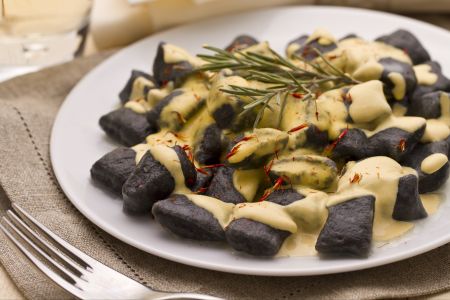 Squid ink gnocchetti with sea bass and saffron sauce