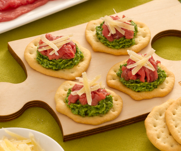 Flatbreads with beef carpaccio, arugula, and Sbrinz