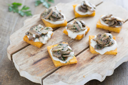 Polenta Crostini with Mushrooms and Grana Padano Fondue