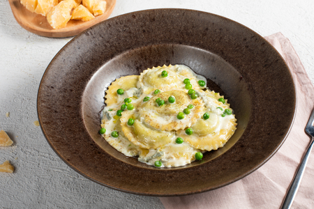 Pea ravioli with gorgonzola fondue