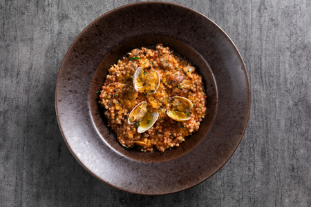 Fregula with clams and bottarga