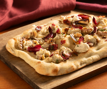 Pinsa with radicchio, speck and walnuts