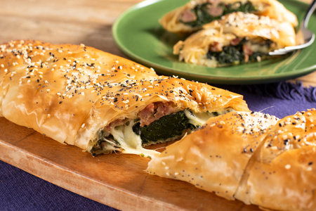 Phyllo pastry strudel with sausage and spinach