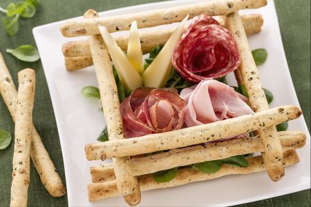 Olive breadsticks with cured meats and cheeses