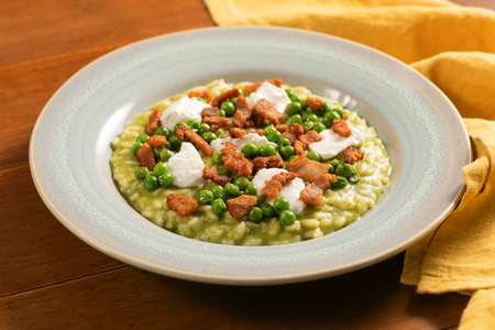 Pea risotto with crescenza and crispy pancetta