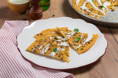 Chickpea farinata with zucchini and pecorino fondue
