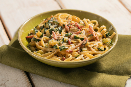 Pasta with zucchini, speck and gorgonzola