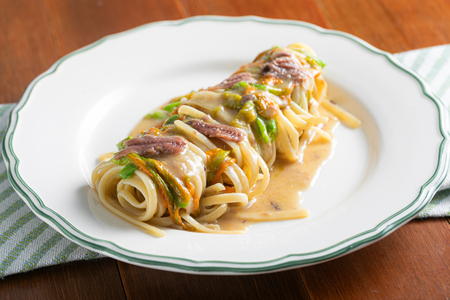 Pasta with zucchini flowers and anchovies