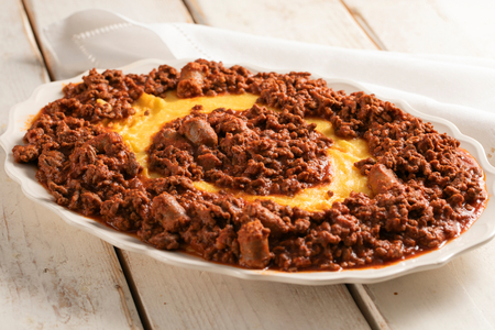 Polenta with braised beef in tomato sauce