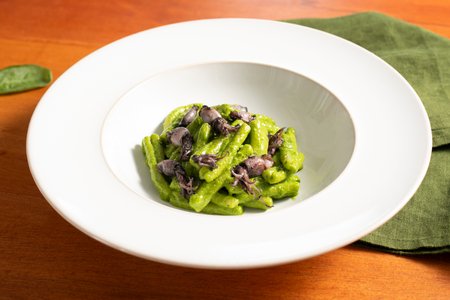 Pasta with baby squid and spinach pesto