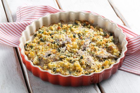 Anchovies baked in a pan