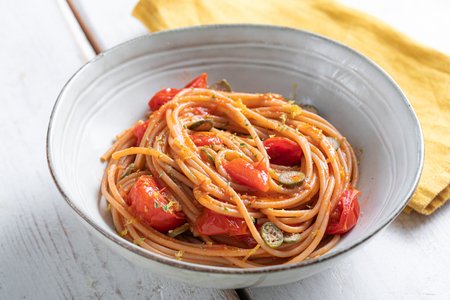 Spaghetti with cherry tomatoes and caperberries
